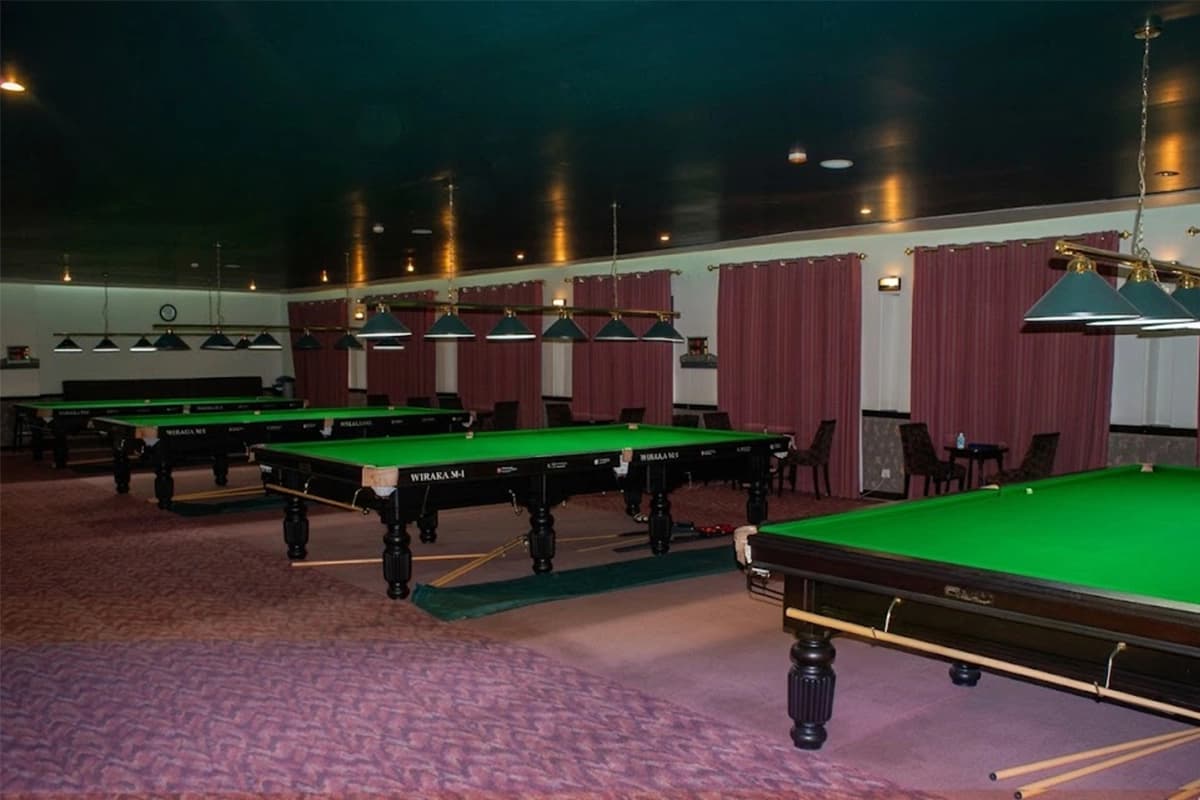 Snooker room green baize tables